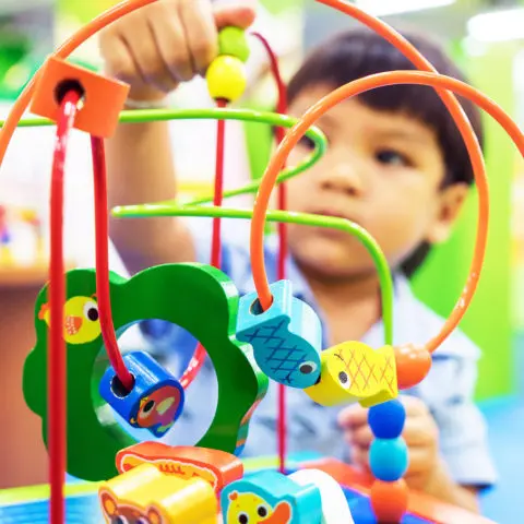 boy-playing-with-loop-toy-480x480